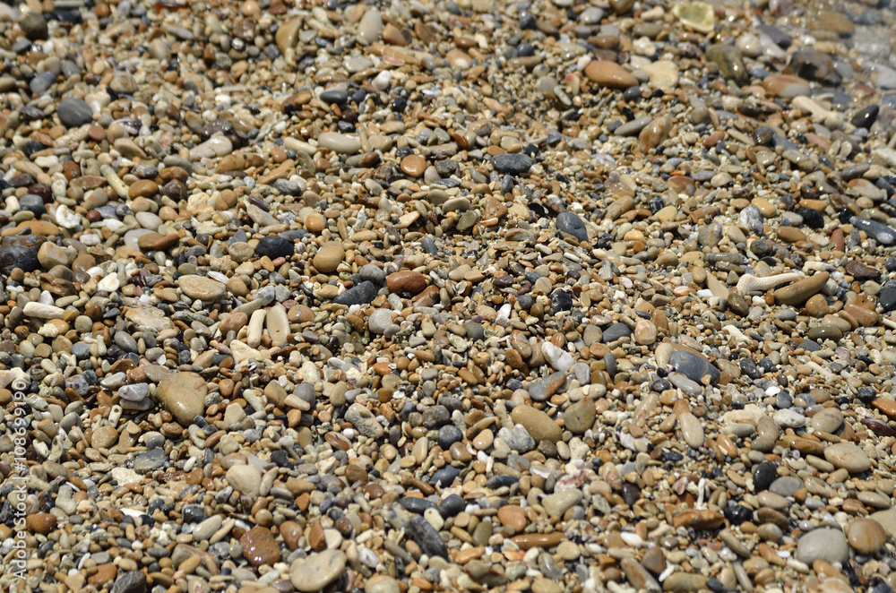 Stone on the beach in midday (Selective focus)
Stone on the beach in midday (Selective focus)