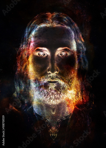 Jesus Christ painting with radiant colorful energy of light in cosmic space, eye contact. © jozefklopacka