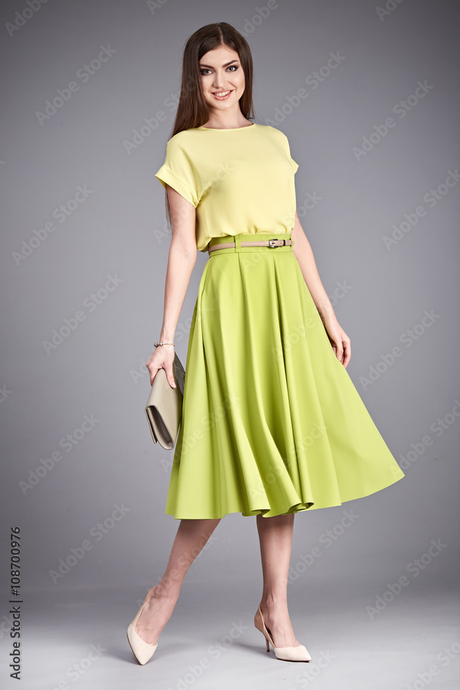 Beautiful sexy glamor woman lady long brunet hair makeup wear fashion clothes silk or cotton blouse trendy skirt lather shoes catalog in studio casual office clothes businesswoman accessory body bag Beautiful sexy glamor woman lady long brunet hair makeup wear fashion clothes silk or cotton blouse trendy skirt lather shoes catalog in studio casual office clothes businesswoman accessory body bag
