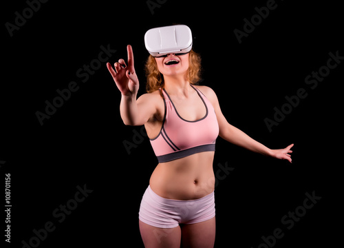 Sexy young woman using virtual reality headset