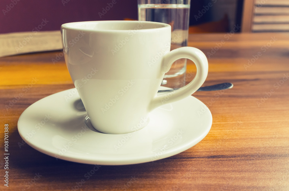 Freshly brewed coffee in a white cup, retro Freshly brewed coffee in a white cup, retro