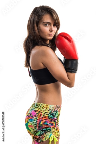 Young girl with boxing gloves © luismolinero