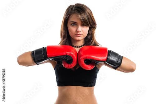 Young girl with boxing gloves © luismolinero