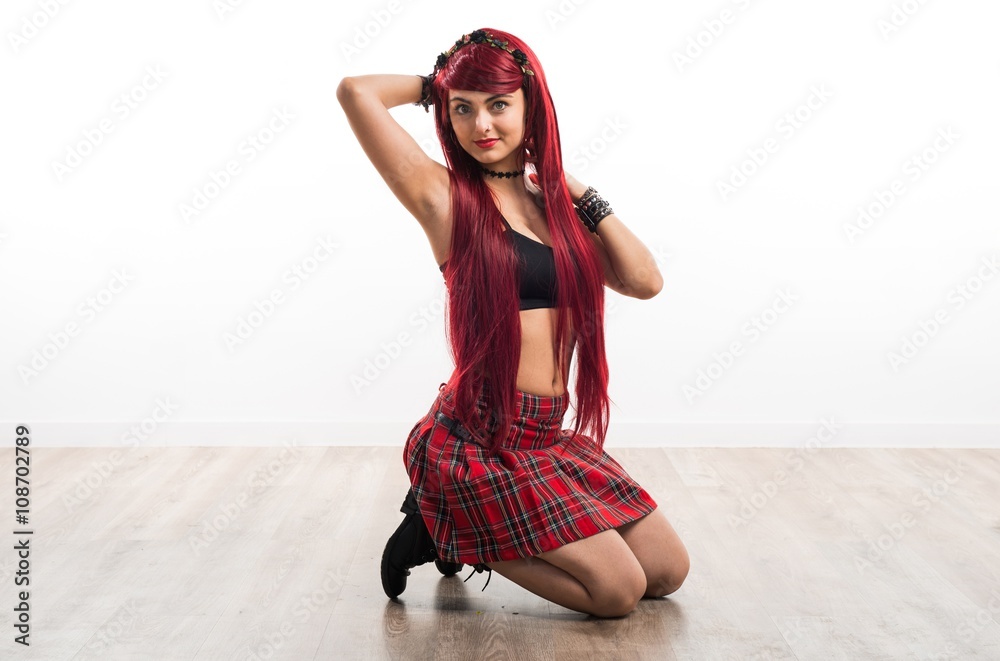 Naklejka premium Young redhead girl posing