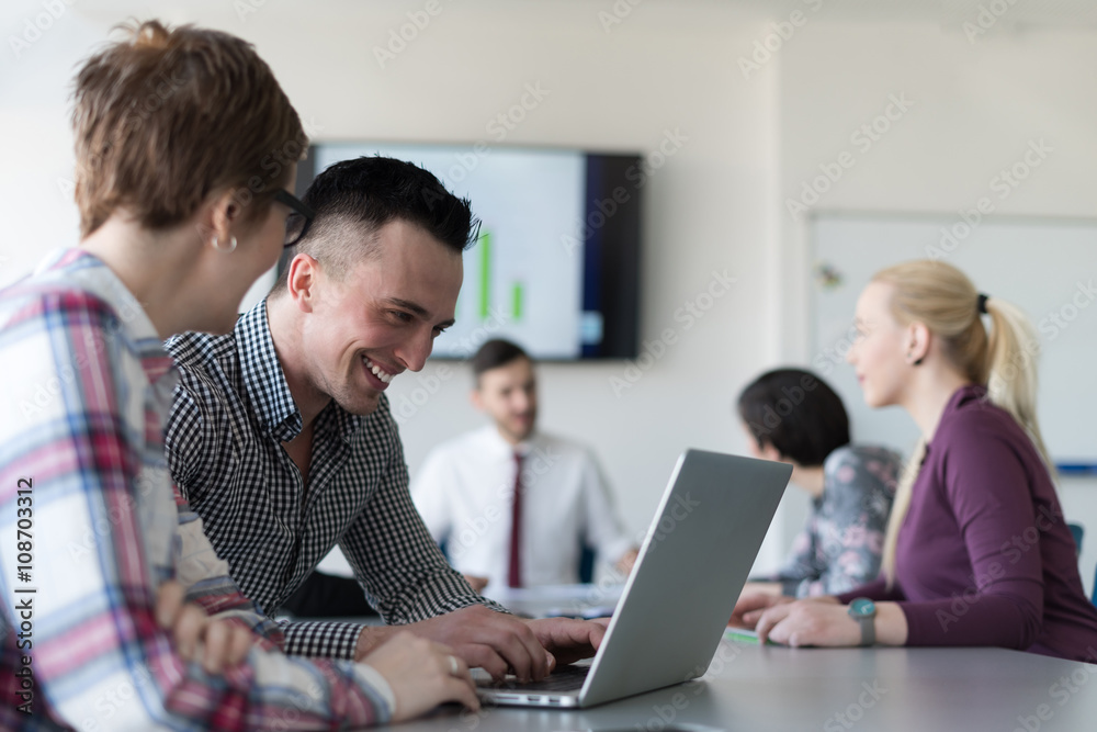 young business couple working on laptop, businesspeople group on young business couple working on laptop, businesspeople group on