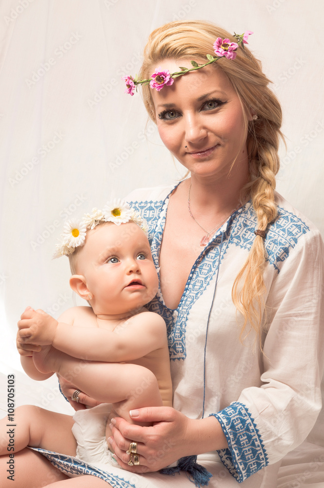 mother and baby girl with wreaths mother and baby girl with wreaths