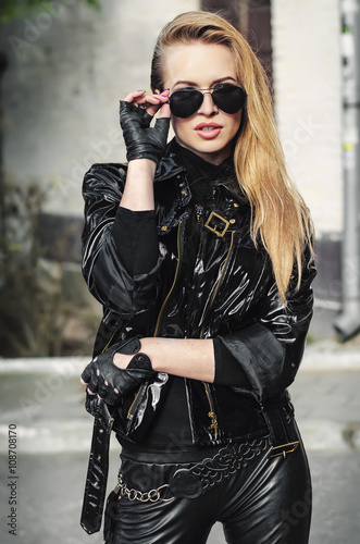 portrait sexy biker woman in black jacket