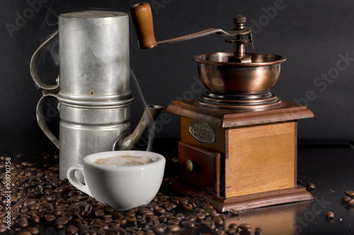 white cup with old Neapolitan coffee on black background