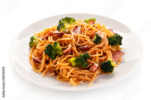 Pasta with pesto sauce, ham, Parmesan and broccoli
