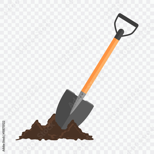 Shovel in the ground. Gardening tool on checked background. photo