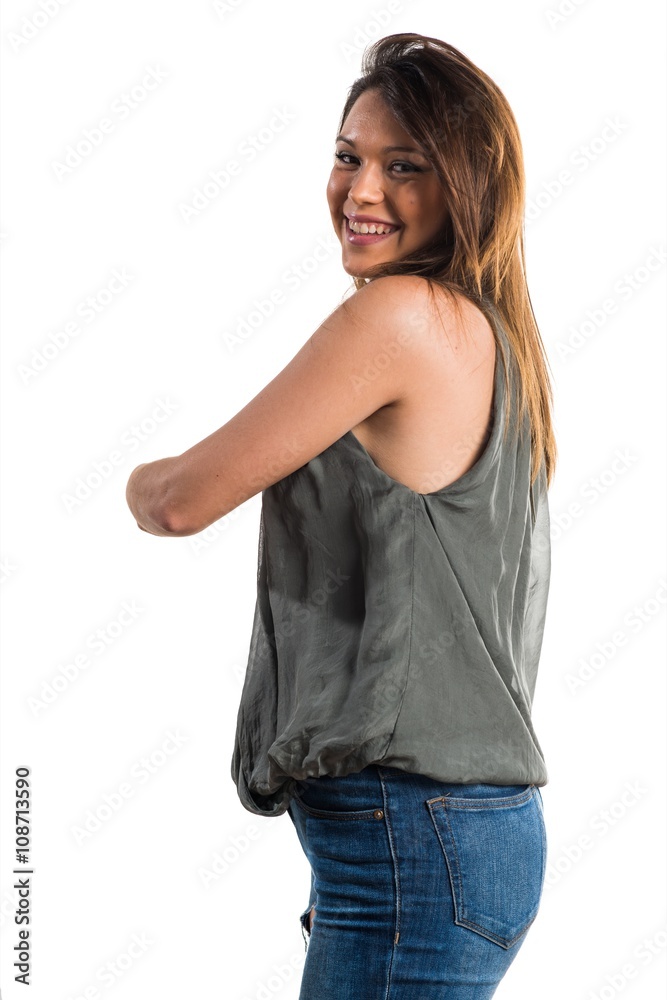 Fototapeta premium Young girl pointing back