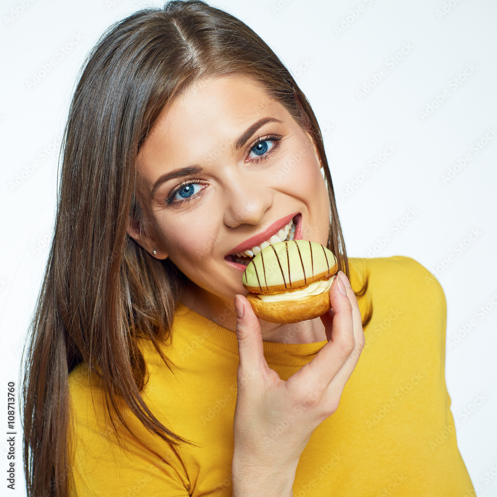 Face portrait of smiling woman biting cake. Face portrait of smiling woman biting cake.