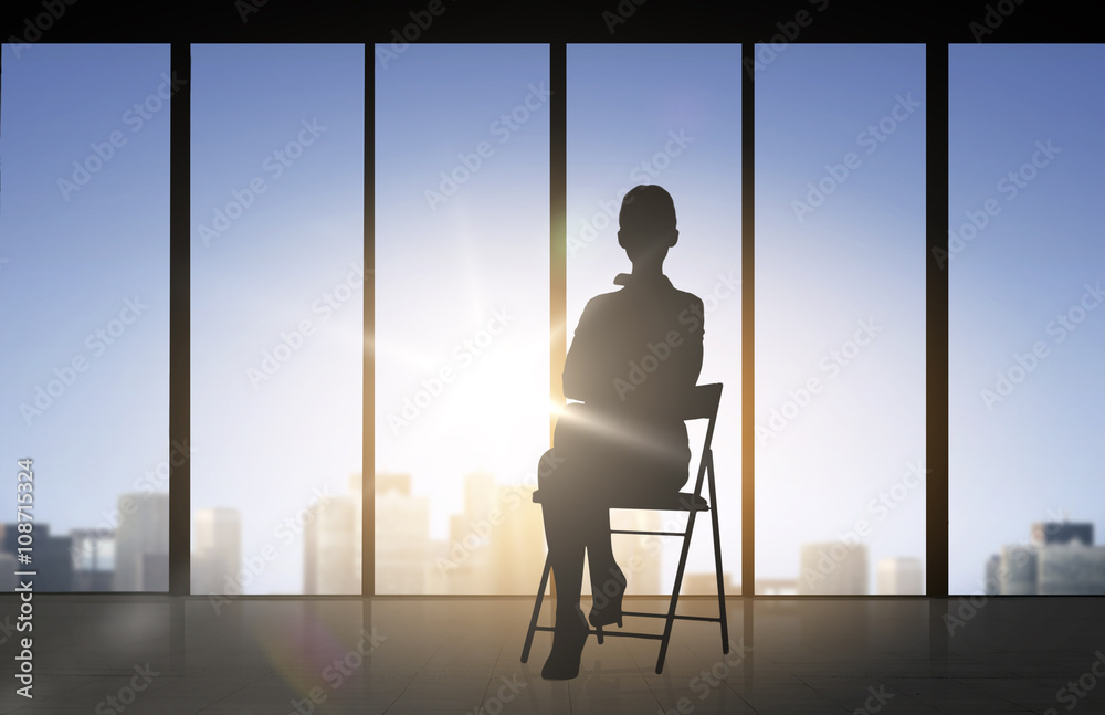 silhouette of business woman sitting on chair