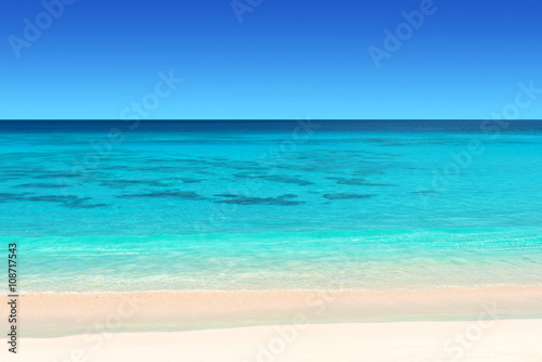 seychelles tropical beach with white sand turquoise water and blue sky