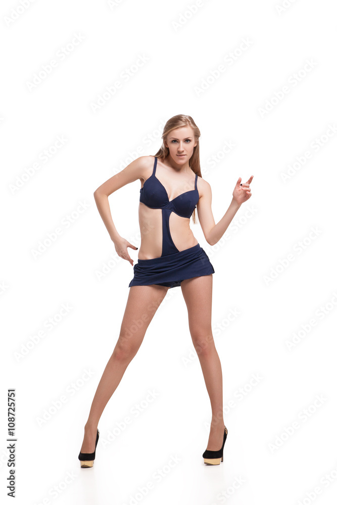 Young beautiful dancer posing on studio background Young beautiful dancer posing on studio background