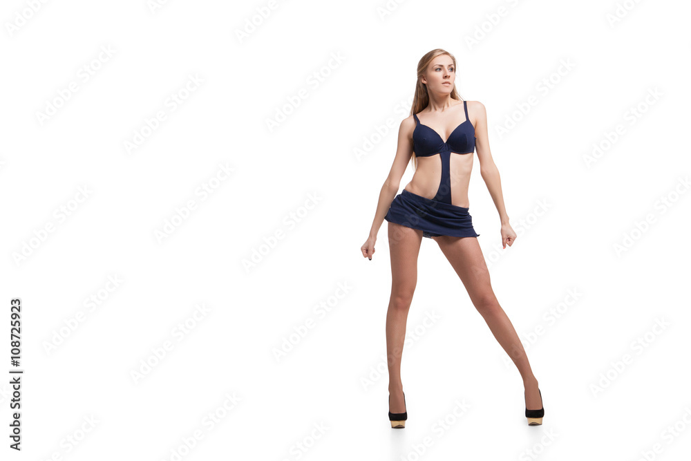 Young beautiful dancer posing on studio background Young beautiful dancer posing on studio background