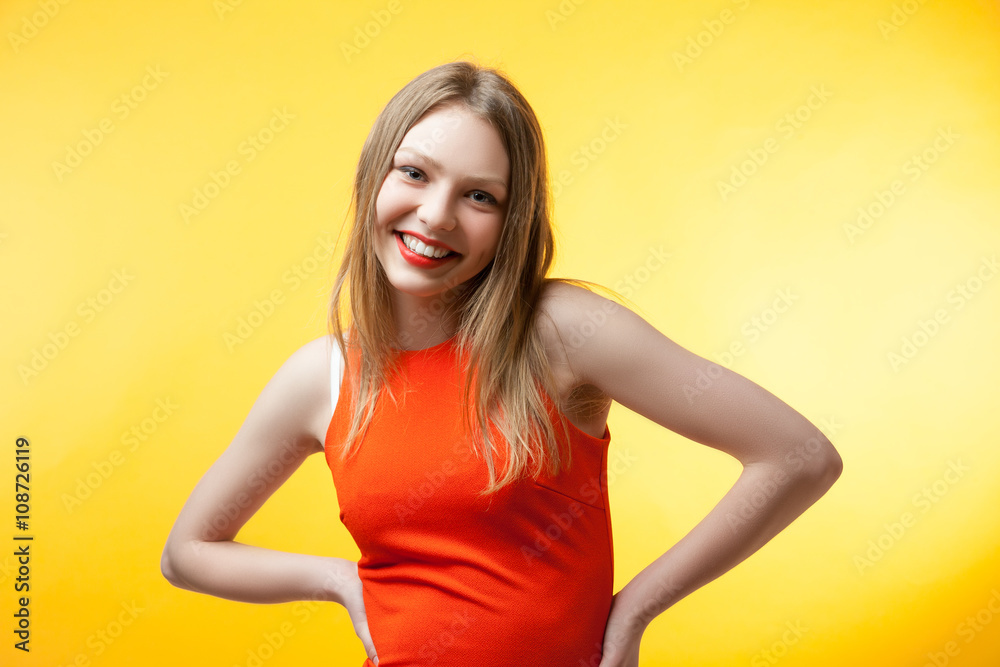 Fashionable young woman in orange dress Fashionable young woman in orange dress