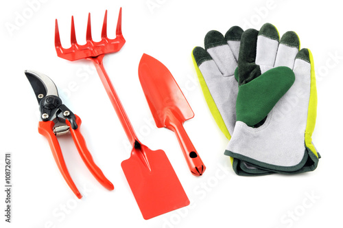 garden shears fork and shovel with gloves photo