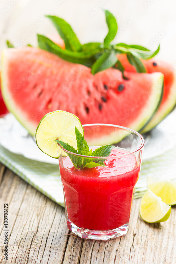 Watermelon juice with lime and mint in the glass Watermelon juice with lime and mint in the glass