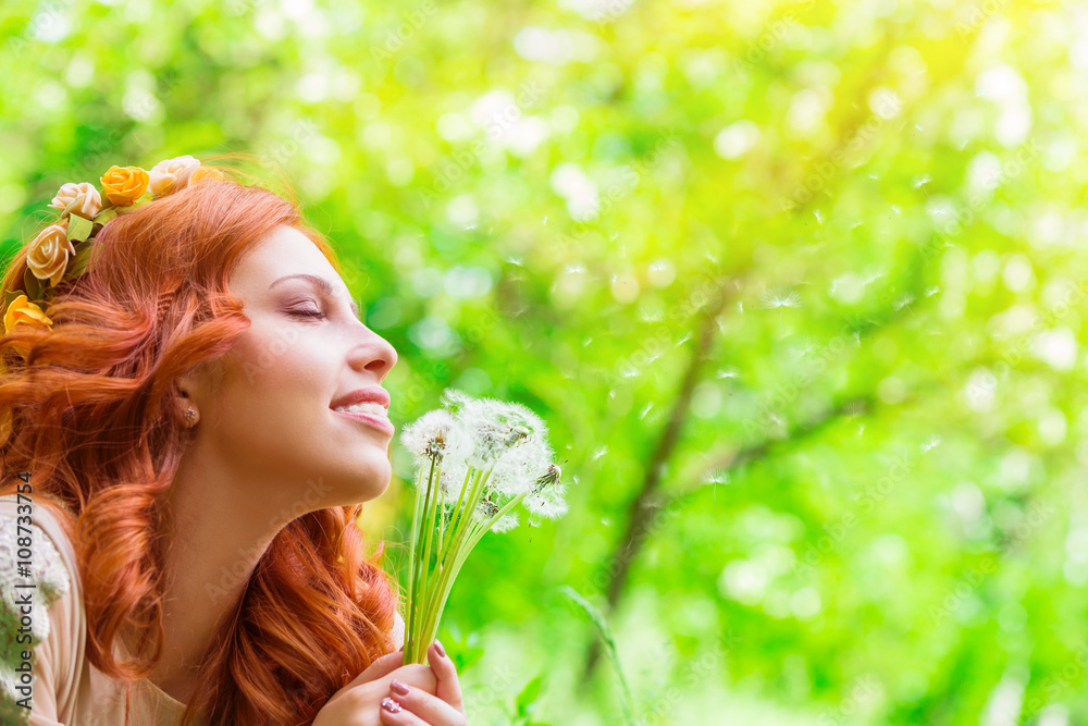 Happy woman with dandelion flowers Happy woman with dandelion flowers