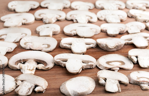 Champignon on wooden background