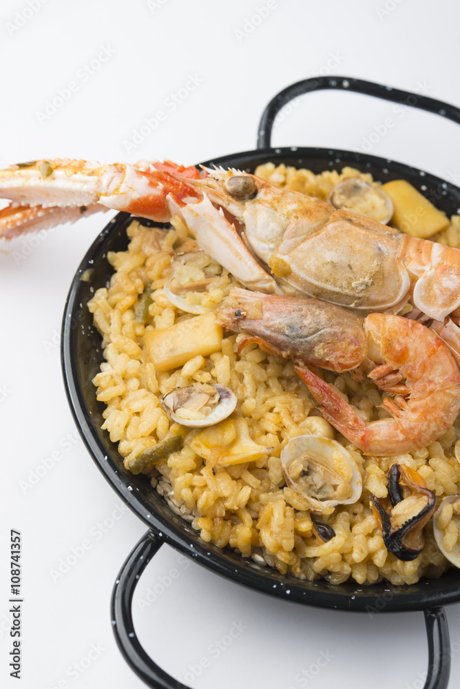 traditional spanish rice - paella isolated on white background traditional spanish rice - paella isolated on white background