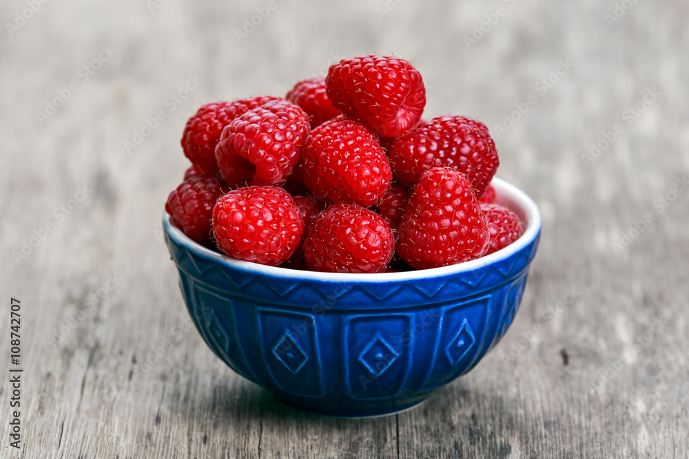 Fresh raspberries in bowl. concept for healthy eating Fresh raspberries in bowl. concept for healthy eating
