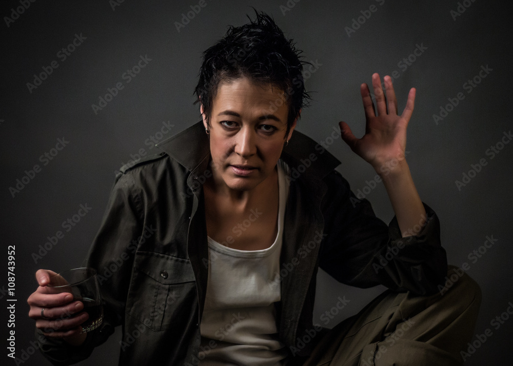 Androgynous character on a gray background. Man or woman. Military style. Very sharp. Androgynous character on a gray background. Man or woman. Military style. Very sharp.
