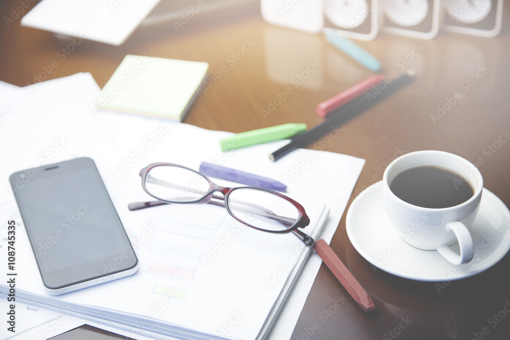 notepad,pencils,coffee and glasses on table notepad,pencils,coffee and glasses on table