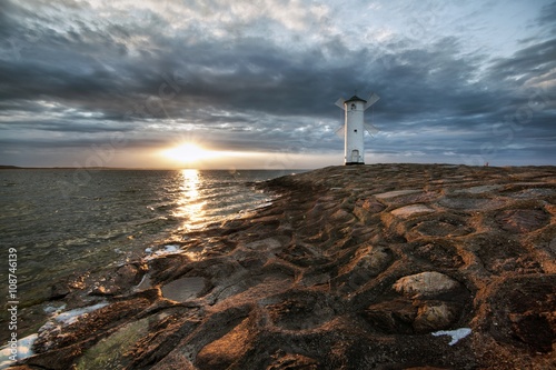 Lighthouse windmill Stawa Mlyny in Swinoujscie, Baltic Sea, Poland.