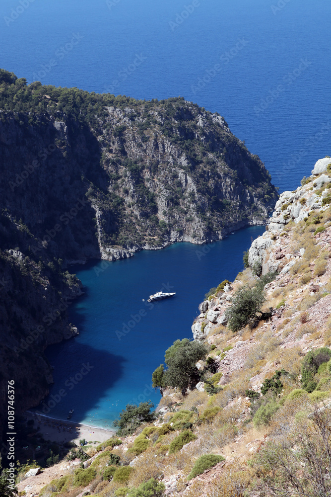 Fototapeta premium Butterlfy Valley Beach in Oludeniz, Fethiye, Turkey. This place's name is Kelebekler Vadisi in Turkish.