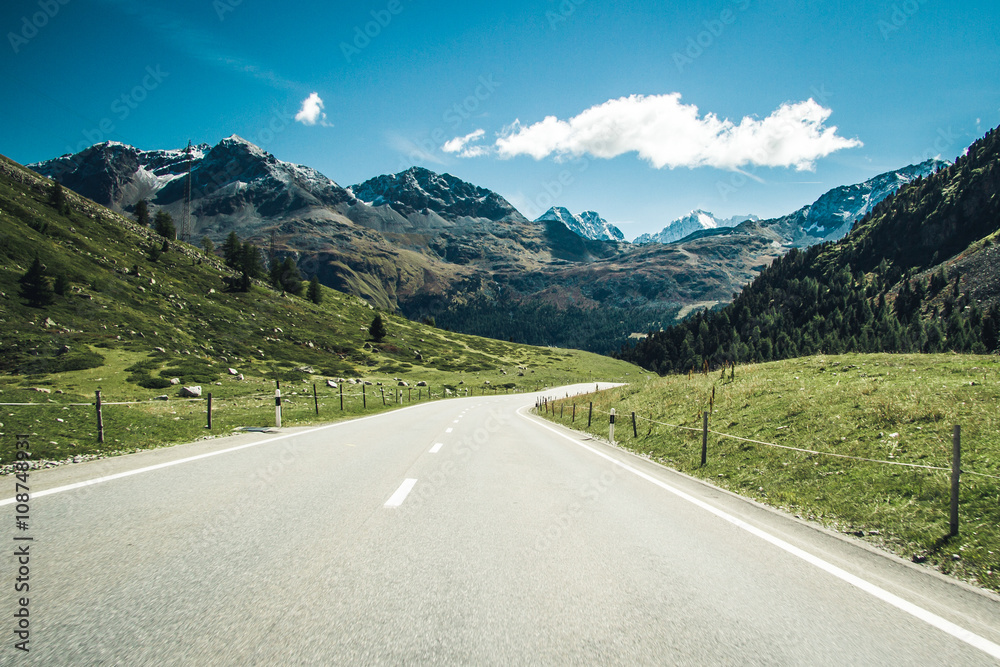 A road through swiss Alps. - obrazy, fototapety, plakaty 