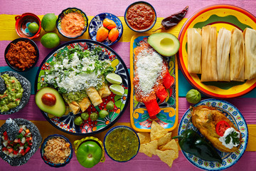Green and red enchiladas with mexican sauces