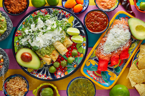Green and red enchiladas with mexican sauces