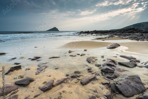 Red rocks on beach in Wembury, Devon, UK photo