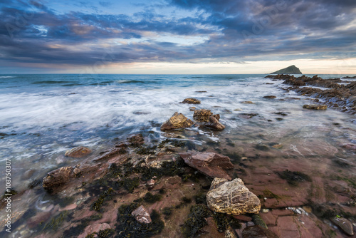 Dramatic clouds at Atlantic ocean at dawn