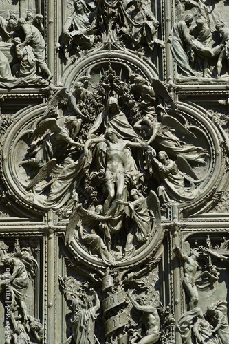 Bronze door of the Milan cathedral detail