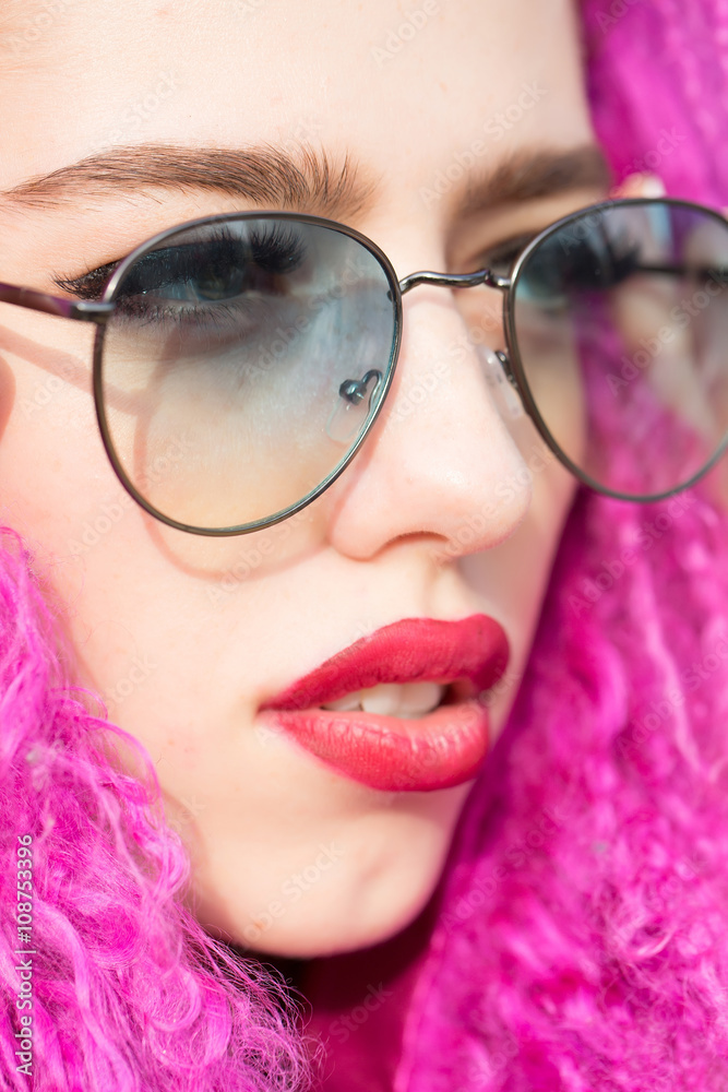 Young woman in sunglasses Young woman in sunglasses