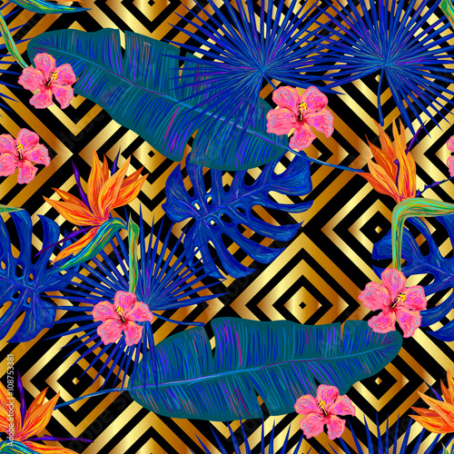 Seamless luxury gold pattern with palm leaves and exotic tropical flowers vector fashion background. Perfect for wallpapers, pattern fills, web page backgrounds, surface textures, textile