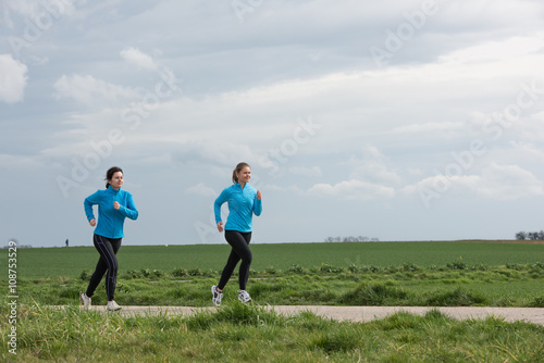 two women jogging outdoors