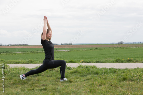 sport woman stetching outdoors photo