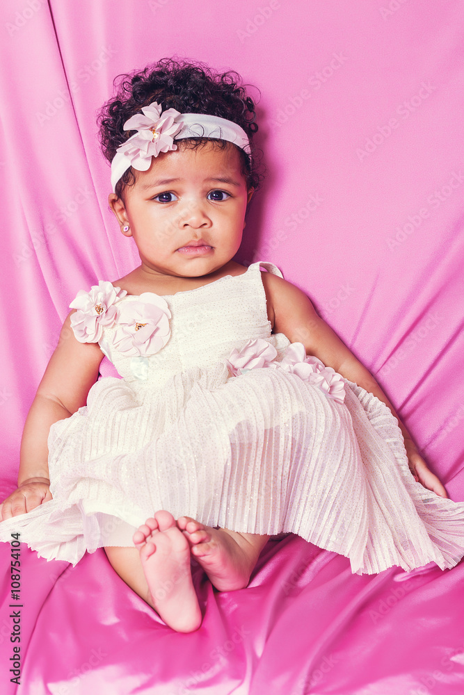 Cute baby girl portrait wearing white floral dress Cute baby girl portrait wearing white floral dress