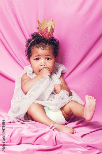 Lovely baby princess portrait looking at camera