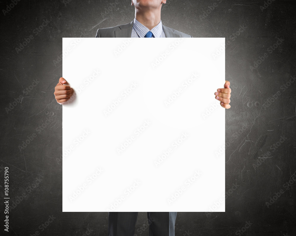 Businessman showing empty banner Businessman showing empty banner