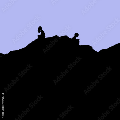 Silhouette of divorced couple sitting on hill