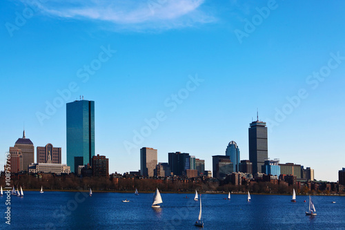 Boston, Massachusetts skyline with sailboats in foreground
