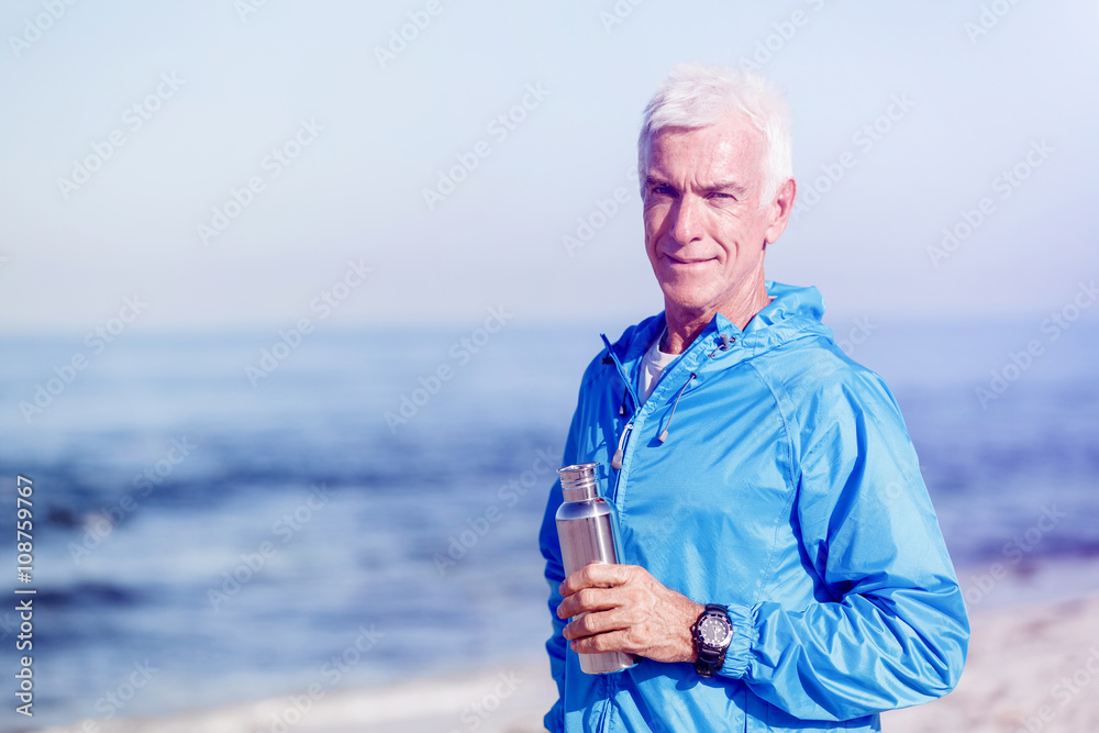 Man drinking from a sports bottle Man drinking from a sports bottle
