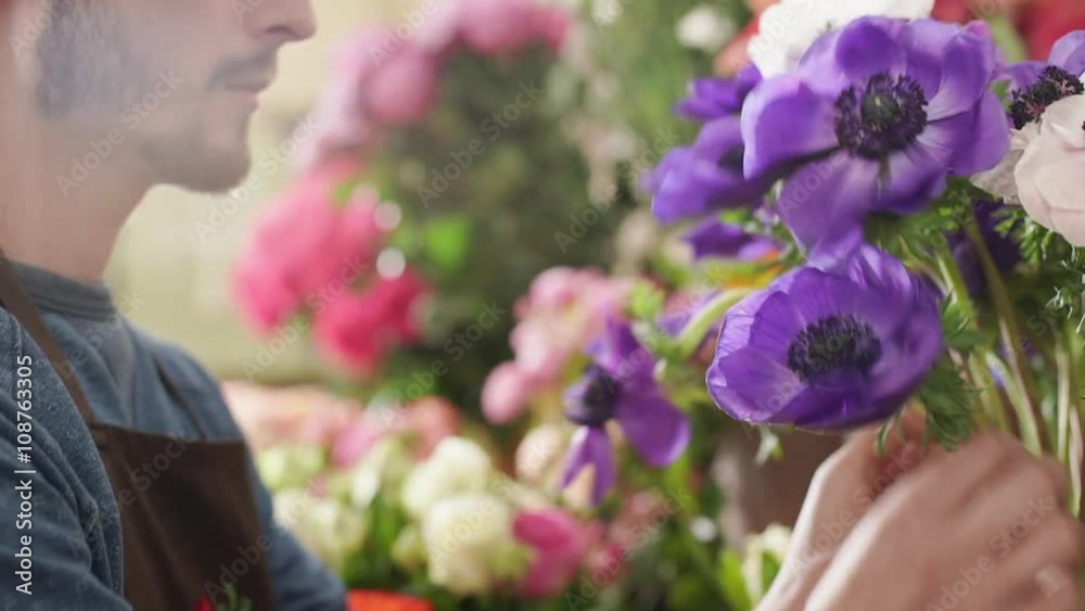 Large array of flowers in florist shop. Slow motion Large array of flowers in florist shop. Slow motion
