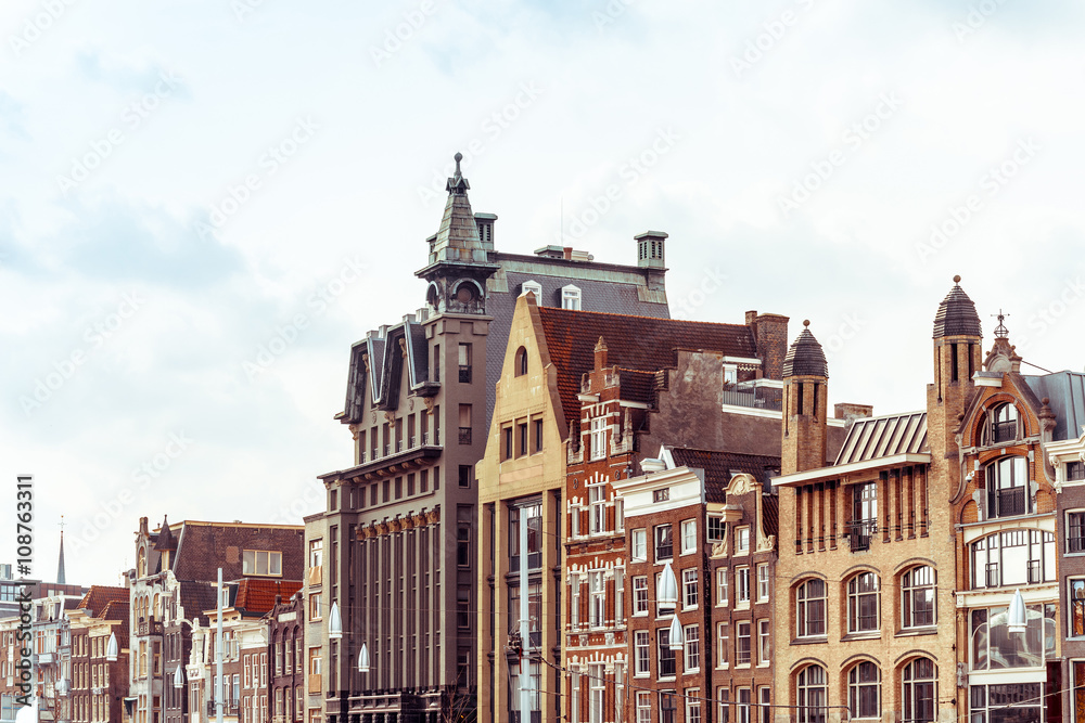 Fototapeta premium Beautiful street view of Traditional old buildings in Amsterdam,