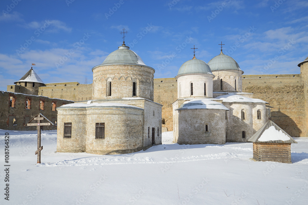 View of the ancient churches of Ivangorod fortress, sunny february day. Ivangorod, Leningrad region, Russia
